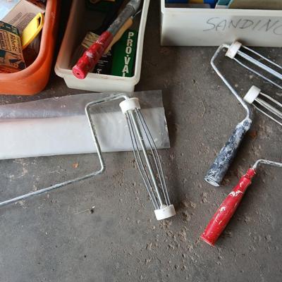 Painting supplies, rollers, brushes, with an assortment of tools to help you paint