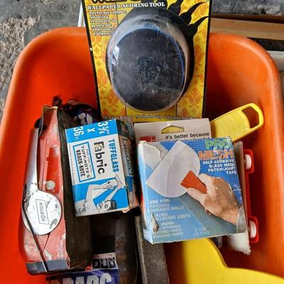 Painting supplies, rollers, brushes, with an assortment of tools to help you paint