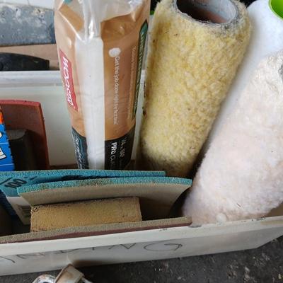 Painting supplies, rollers, brushes, with an assortment of tools to help you paint