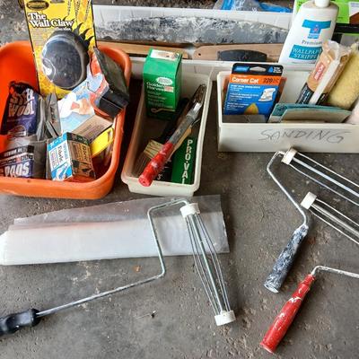 Painting supplies, rollers, brushes, with an assortment of tools to help you paint