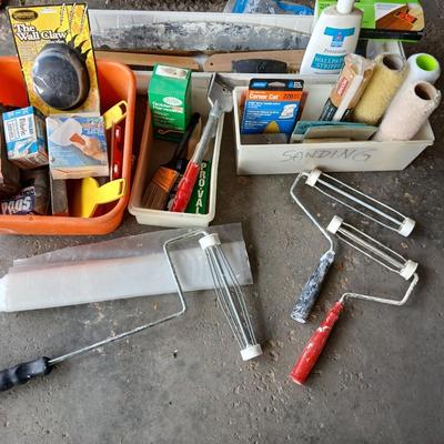 Painting supplies, rollers, brushes, with an assortment of tools to help you paint