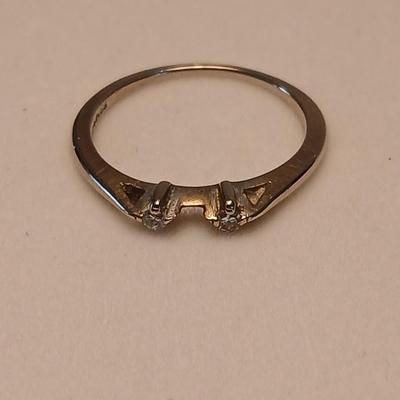 Marked 14 nx? ring with two small stones