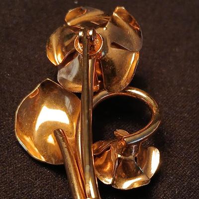 Two fashion necklaces with brooches and earrings