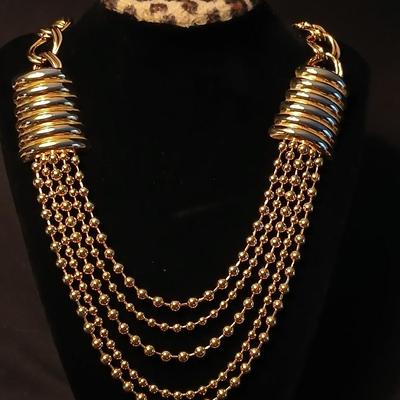 Two fashion necklaces with brooches and earrings