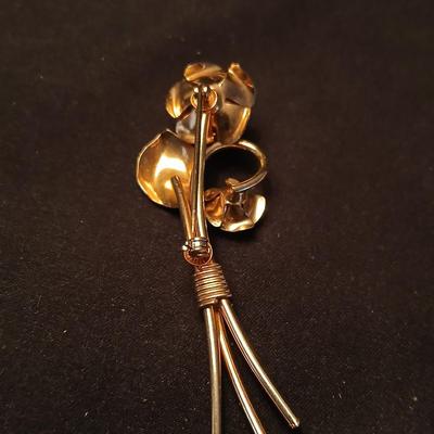 Two fashion necklaces with brooches and earrings