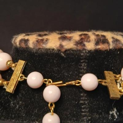 Two fashion necklaces with brooches and earrings