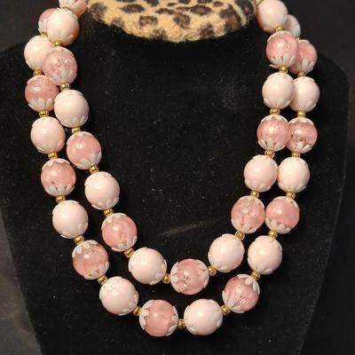 Two fashion necklaces with brooches and earrings