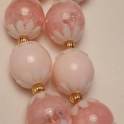 Two fashion necklaces with brooches and earrings