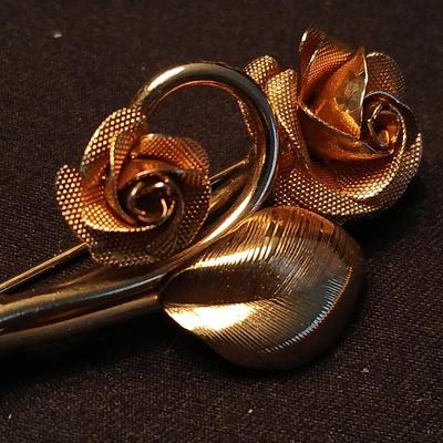 Two fashion necklaces with brooches and earrings