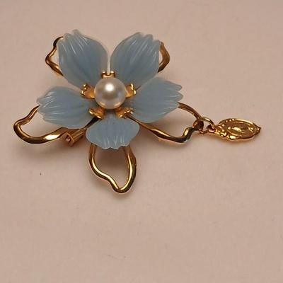 Heart pendant with pearl in the center and a vintage flower brooch