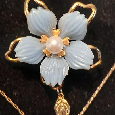 Heart pendant with pearl in the center and a vintage flower brooch