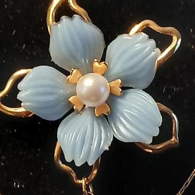 Heart pendant with pearl in the center and a vintage flower brooch