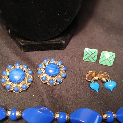 Beaded costume jewelry necklaces and earrings with faux book storage box