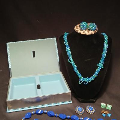 Beaded costume jewelry necklaces and earrings with faux book storage box