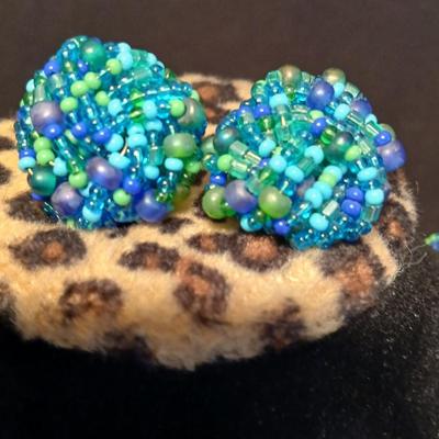 Beaded costume jewelry necklaces and earrings with faux book storage box