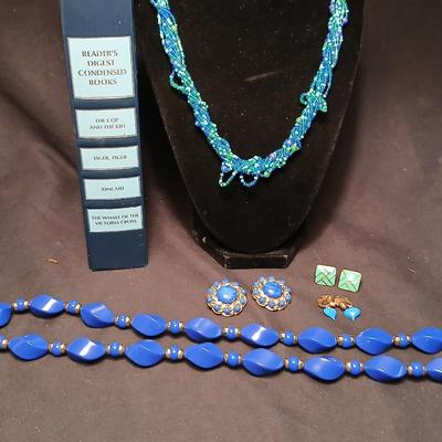 Beaded costume jewelry necklaces and earrings with faux book storage box