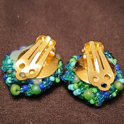 Beaded costume jewelry necklaces and earrings with faux book storage box