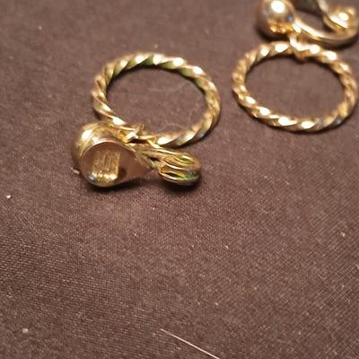 Long multi-chain necklace with an assortment of clip-on earrings