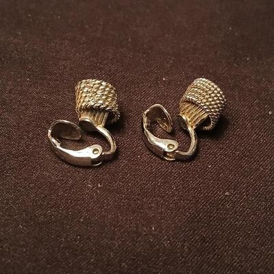 Long multi-chain necklace with an assortment of clip-on earrings