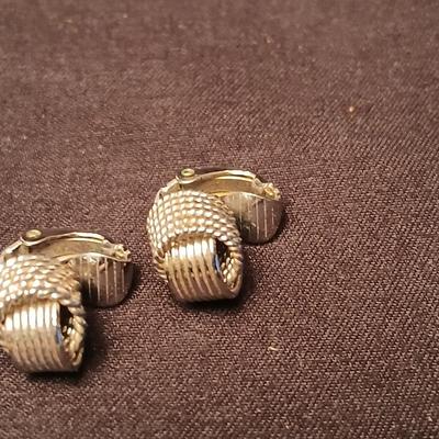 Long multi-chain necklace with an assortment of clip-on earrings