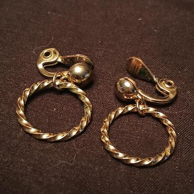 Long multi-chain necklace with an assortment of clip-on earrings