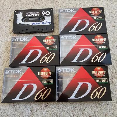 Aiwa Walkman with earphones and cassette tapes