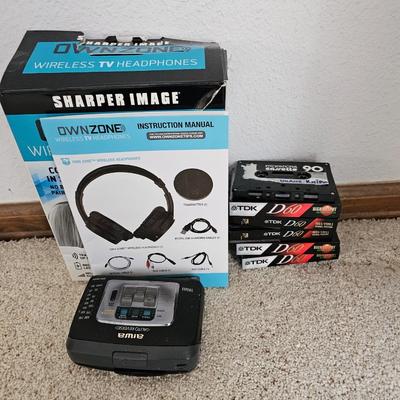 Aiwa Walkman with earphones and cassette tapes