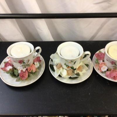 Three Tea Cups Candles With Flowers.