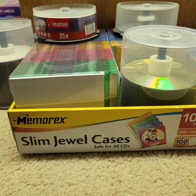 Lot of recordable CDs and DVDs l, labels and jewels