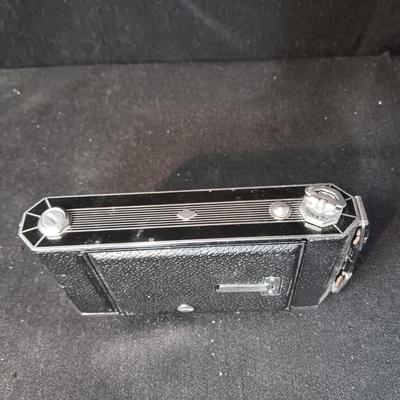 SIX-20 KODAK BLACK FOLDING CAMERA WITH FOCUSING DOUBLET LENS