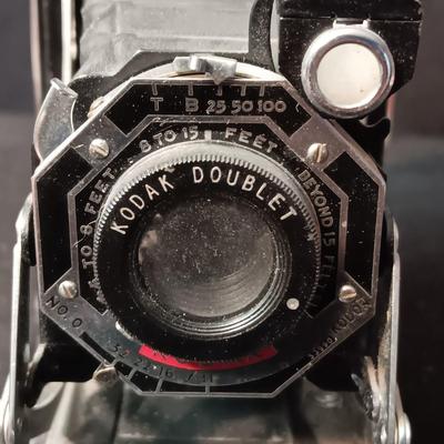 SIX-20 KODAK BLACK FOLDING CAMERA WITH FOCUSING DOUBLET LENS