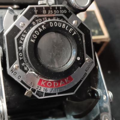 SIX-20 KODAK BLACK FOLDING CAMERA WITH FOCUSING DOUBLET LENS