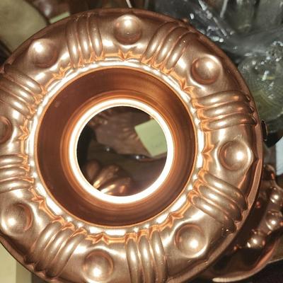Five copper jello molds and candy dish