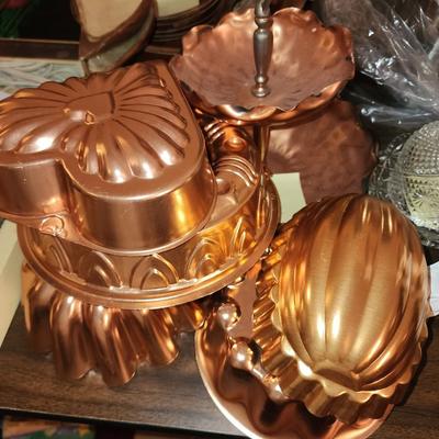 Five copper jello molds and candy dish