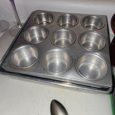 Box of baking sheets with shapes and more.