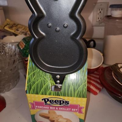 Box of baking sheets with shapes and more.