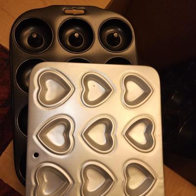 Box of baking sheets with shapes and more.