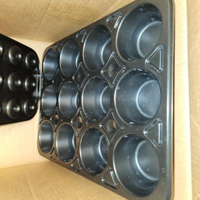 Box of baking sheets with shapes and more.