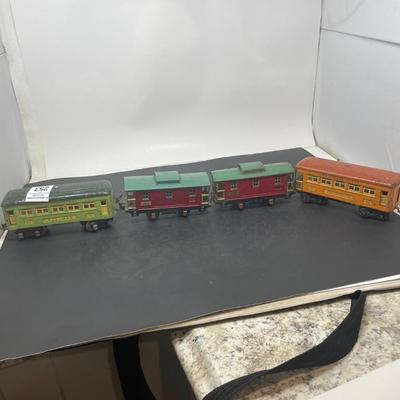 Sale Photo Thumbnail #169: Description: Lionel 2 Passenger Cars 2 Cabooses, Part of a Prewar Collectibe Trains Estate Collection; Measurement Approximate: "h x "w; Material: