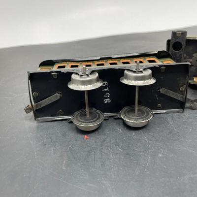 Sale Photo Thumbnail #301: Description: German Tinplate Clockwork Engine & Passenger Cars, Part of a Prewar Collectibe Trains Estate Collection; Measurement Approximate: "h x "w; Material: