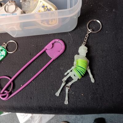 PLASTIC STORAGE CONTAINER FILLED WITH UNIQUE KEYCHAINS