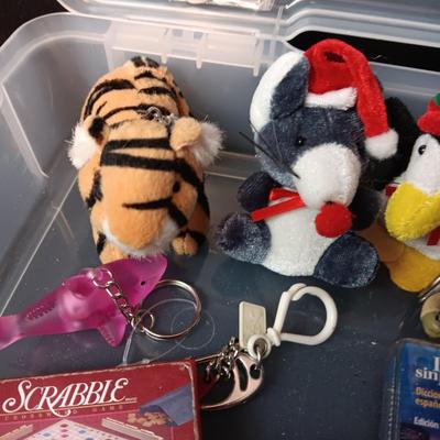 PLASTIC STORAGE CONTAINER FILLED WITH UNIQUE KEYCHAINS