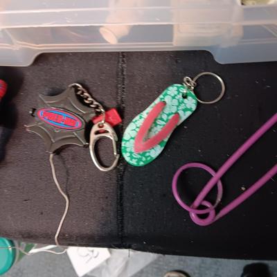PLASTIC STORAGE CONTAINER FILLED WITH UNIQUE KEYCHAINS