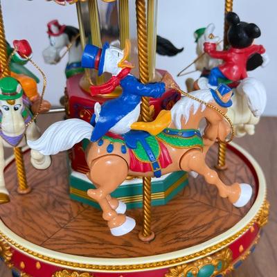 LOT 40B: Disney Mr. Christmas Mickey Holiday Go Round & Porcelain 2003 Mickey Santa Statue