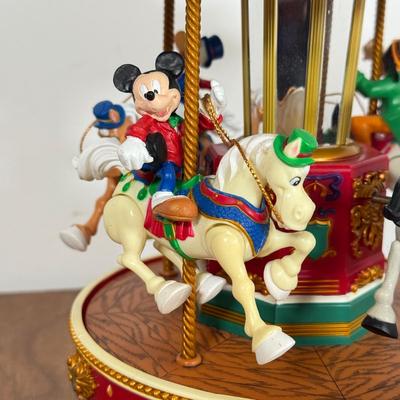 LOT 40B: Disney Mr. Christmas Mickey Holiday Go Round & Porcelain 2003 Mickey Santa Statue