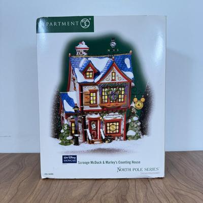 LOT 45B: Disney Department 56 w/ Boxes - North Pole Series Scrooge McDuck & Marley's Counting House, Pinocchio & Minnie...