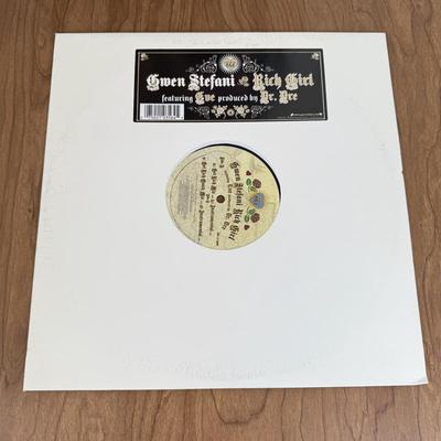 LOT 49B: Vinyl Record Collection w/ Metal Magazine Rack - Mariah Carey, Britney Spears, Gwen Stefani, Beyonce & More