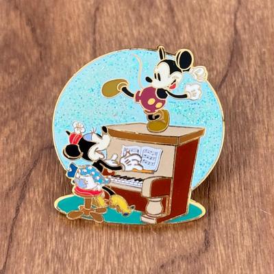 LOT 50A: Walt Disney World Pin Trading Bag w/ Collection of Disney Trading Pins including LE500 Mickey Dancing w/ Minnie Playing Piano
