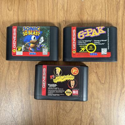 LOT 79B: Vintage Sega Genesis Nomad Video Game System Model MK-6100 w/ 7 Games - Sonic, Pacman, Beavis and Butthead