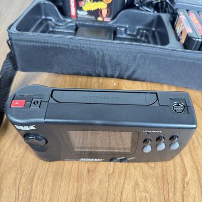 LOT 79B: Vintage Sega Genesis Nomad Video Game System Model MK-6100 w/ 7 Games - Sonic, Pacman, Beavis and Butthead
